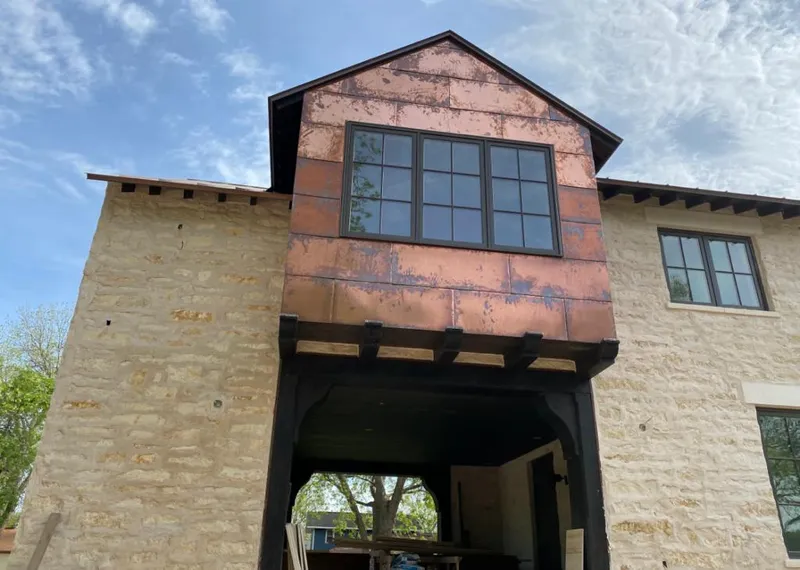 Copper metal panel facade on a stone building for Metal Roof Coating in Van Alstyne