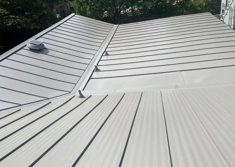 Solar attic fan installed on a metal roof for Roof Ventilation in Van Alstyne